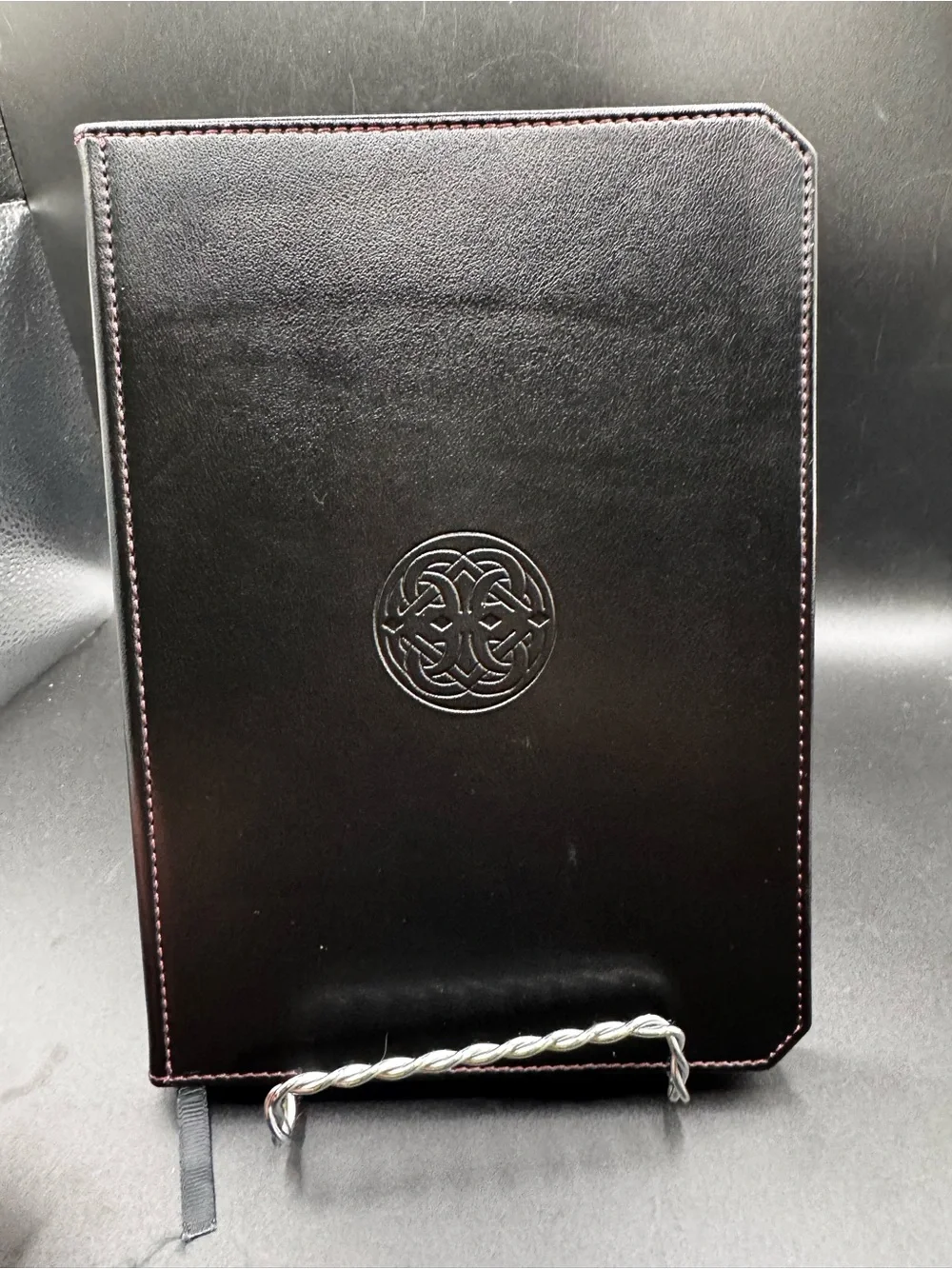Franklin-Christoph Firma-Flex Notebook featuring a debossed circular Celtic knot
